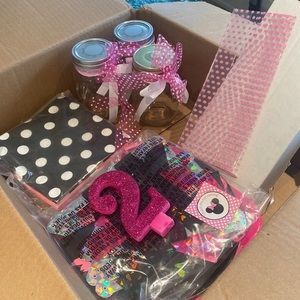 Box of Mini mouse birthday party decorations